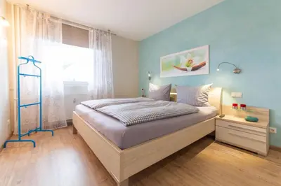 Ein Bett oder Betten in einem Zimmer der Unterkunft Ferienwohnung Beau Rivage Seaside