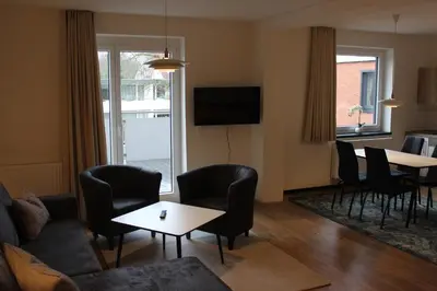 TV/Unterhaltungsangebot in der Unterkunft Dünenhaus Wohnung11