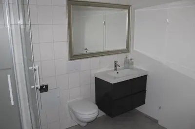 Ein Badezimmer in der Unterkunft Dünenhaus Wohnung 7