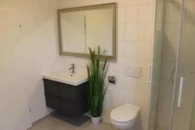 Ein Badezimmer in der Unterkunft Dünenhaus Wohnung 8