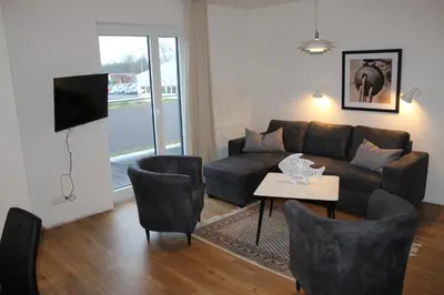 Ein Sitzbereich in der Unterkunft Dünenhaus Wohnung 8
