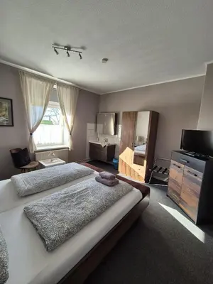 Ein Bett oder Betten in einem Zimmer der Unterkunft Ostsee Pension Pohnsdorfer Mühle