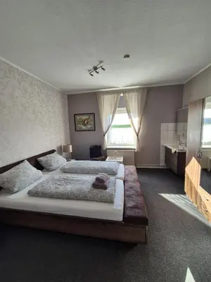 Ein Bett oder Betten in einem Zimmer der Unterkunft Ostsee Pension Pohnsdorfer Mühle