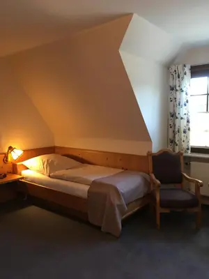 Ein Bett oder Betten in einem Zimmer der Unterkunft Flair Landhotel Strengliner Mühle