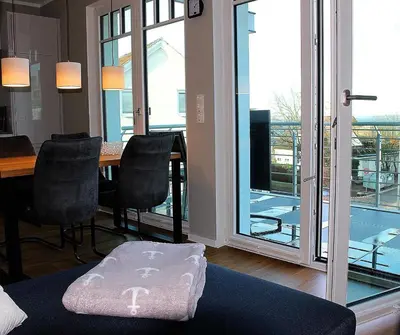 Ein Sitzbereich in der Unterkunft Objekt 96 - Appartement Meerblick