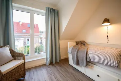 Ein Bett oder Betten in einem Zimmer der Unterkunft Ferienhaus SOUTH COAST