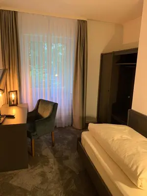 Ein Bett oder Betten in einem Zimmer der Unterkunft Waldhotel Riesebusch