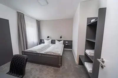 Ein Bett oder Betten in einem Zimmer der Unterkunft Waldhotel Riesebusch