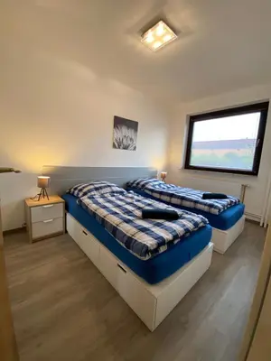 Ein Bett oder Betten in einem Zimmer der Unterkunft Apartment in Uninähe