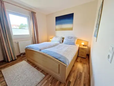 Ein Bett oder Betten in einem Zimmer der Unterkunft (STR132a) Haus Maren am Meer