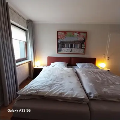 Ein Bett oder Betten in einem Zimmer der Unterkunft Ferienwohnung GOMO