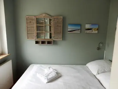 Ein Bett oder Betten in einem Zimmer der Unterkunft Ostseekrabbe-Timmendorfer Strand , strandnah , Wlan , Parkplatz