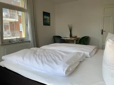 Ein Bett oder Betten in einem Zimmer der Unterkunft Schipperhus