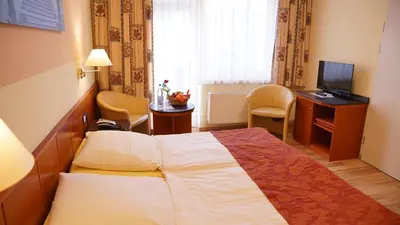 Ein Bett oder Betten in einem Zimmer der Unterkunft Aura Hotel