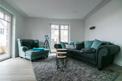Ein Sitzbereich in der Unterkunft Haus Strandgut