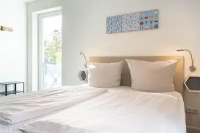 Ein Bett oder Betten in einem Zimmer der Unterkunft Ferienwohnung Reede 54