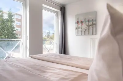 Ein Bett oder Betten in einem Zimmer der Unterkunft Ferienwohnung Reede 54