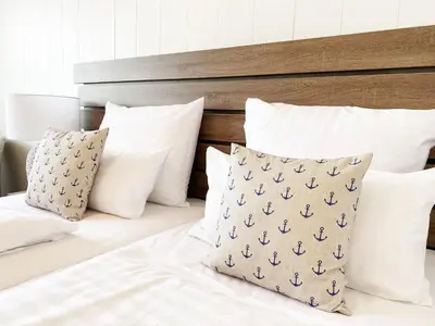 Ein Bett oder Betten in einem Zimmer der Unterkunft Hotel Yachtclub