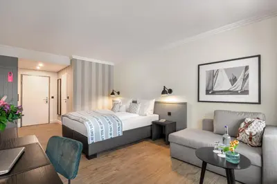 Ein Bett oder Betten in einem Zimmer der Unterkunft Hotel Yachtclub