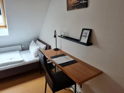 Ein Bett oder Betten in einem Zimmer der Unterkunft Hotel Herrenhof