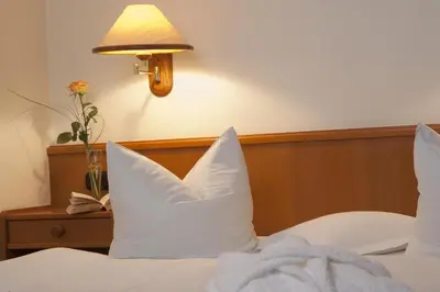 Ein Bett oder Betten in einem Zimmer der Unterkunft Hotel Parkfrieden