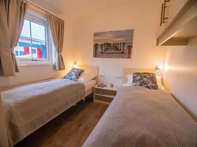 Ein Bett oder Betten in einem Zimmer der Unterkunft Strand 15