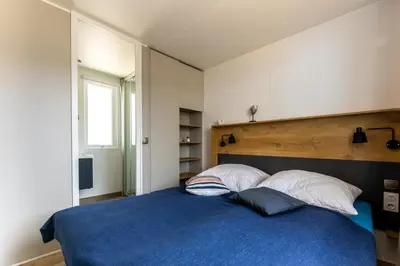 Ein Bett oder Betten in einem Zimmer der Unterkunft Muschel 56