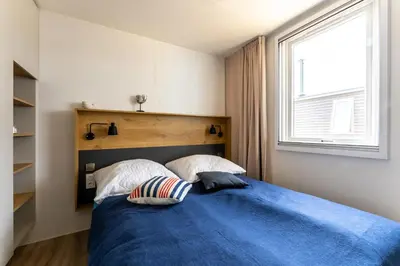 Ein Bett oder Betten in einem Zimmer der Unterkunft Muschel 59