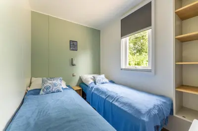 Ein Bett oder Betten in einem Zimmer der Unterkunft Muschel 61