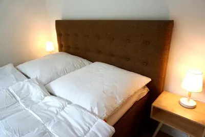 Ein Bett oder Betten in einem Zimmer der Unterkunft Strandglück