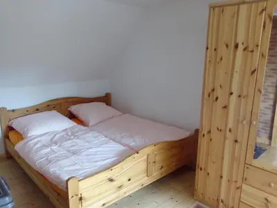 Ein Bett oder Betten in einem Zimmer der Unterkunft Ferienwohnung Haus Lüdtke