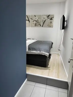 Ein Bett oder Betten in einem Zimmer der Unterkunft Ferienwohnung am Traveufer