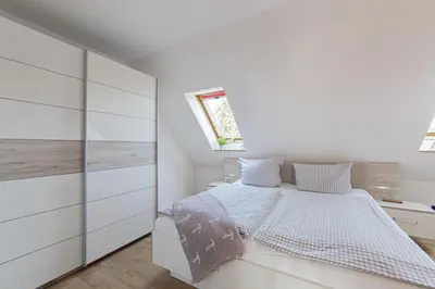 Ein Bett oder Betten in einem Zimmer der Unterkunft Ferienwohnung Ostseeherz Scharbeutz