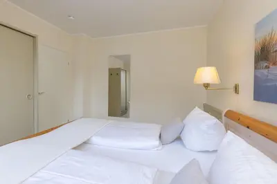Ein Bett oder Betten in einem Zimmer der Unterkunft Haus am Kurpark Scharbeutz Wohnung 5