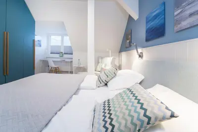 Ein Bett oder Betten in einem Zimmer der Unterkunft Tanneneck Möwe