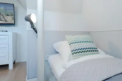 Ein Bett oder Betten in einem Zimmer der Unterkunft Tanneneck Möwe