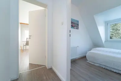 Ein Bett oder Betten in einem Zimmer der Unterkunft Ostseeferne