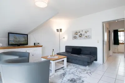 Ein Sitzbereich in der Unterkunft Alte Bergstraße 6 Dorschdüne
