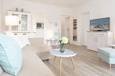 Ein Sitzbereich in der Unterkunft Haus Beau Rivage Strandbude