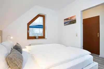 Ein Bett oder Betten in einem Zimmer der Unterkunft Alte Bergstraße 6 Windgeflüster
