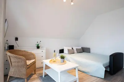 Ein Bett oder Betten in einem Zimmer der Unterkunft Alte Bergstraße 6 Windgeflüster