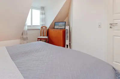 Ein Bett oder Betten in einem Zimmer der Unterkunft Hansa-Residenz Wellenklang