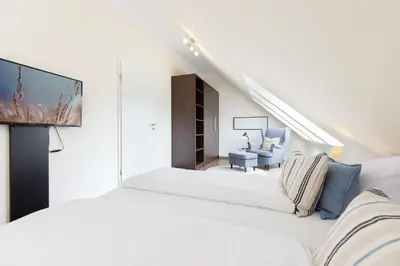 Ein Bett oder Betten in einem Zimmer der Unterkunft Baltic Sea Lodge Küstenidyll