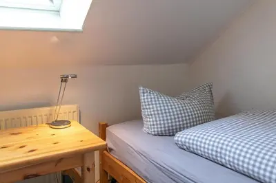 Ein Bett oder Betten in einem Zimmer der Unterkunft Familyhaus- Wohnung 8