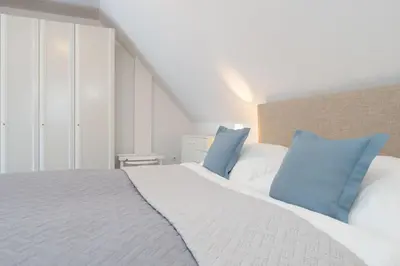 Ein Bett oder Betten in einem Zimmer der Unterkunft Kastanienallee 3