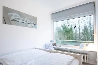 Ein Bett oder Betten in einem Zimmer der Unterkunft Hang 13 De Strandloper