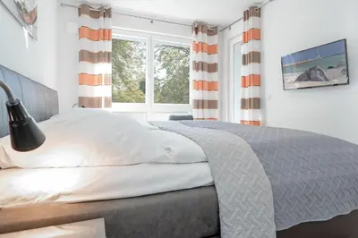 Ein Bett oder Betten in einem Zimmer der Unterkunft Strandvilla Augustusbad Ostseeparadies