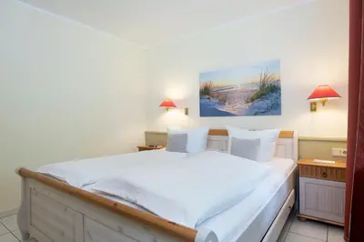 Ein Bett oder Betten in einem Zimmer der Unterkunft Haus am Kurpark Scharbeutz Wohnung 3
