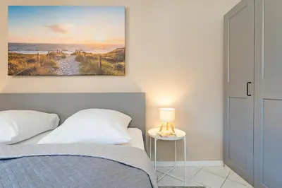 Ein Bett oder Betten in einem Zimmer der Unterkunft Hansa-Residenz Strandglück