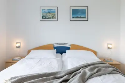 Ein Bett oder Betten in einem Zimmer der Unterkunft Hanseaten Residenz App 19